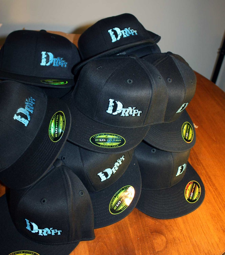 pile of DRYFT flat brim fishing hats
