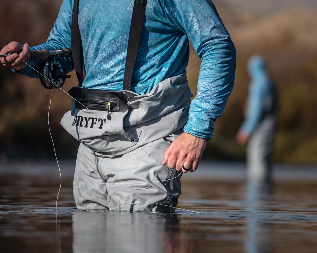 Session Lite Convertible Breathable fishing waders being used in the backcountry