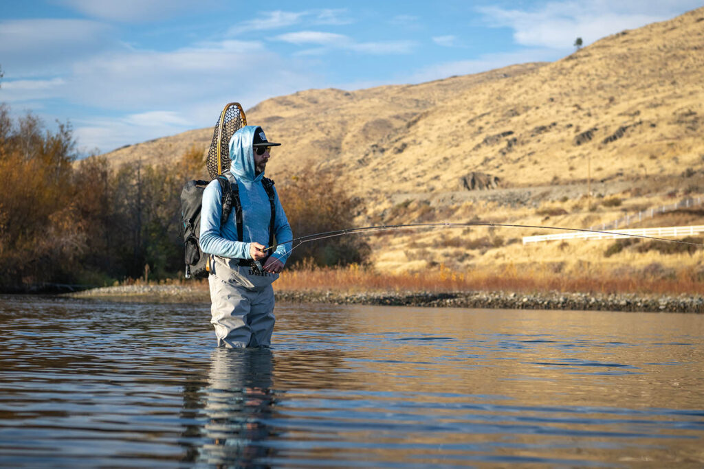 Session Lite Convertible Breathable fishing waders being used in the backcountry